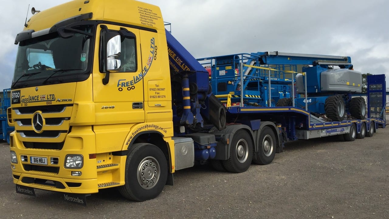 low loader truck with boom lift