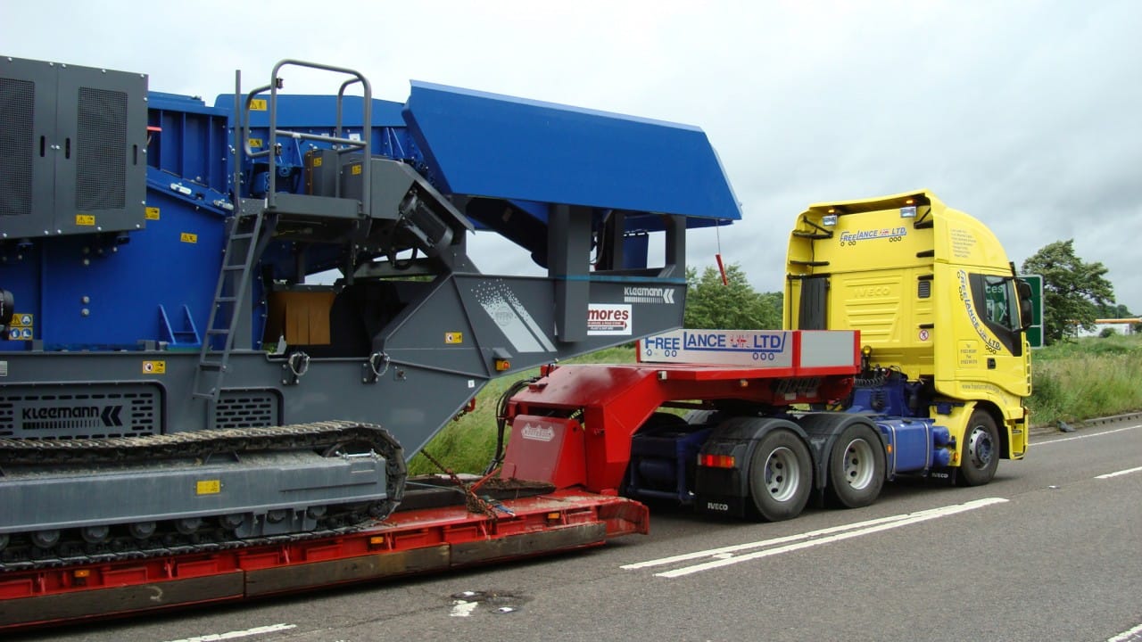 Specialist haulage truck delivering large access equipment