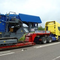 Specialist haulage truck delivering large access equipment